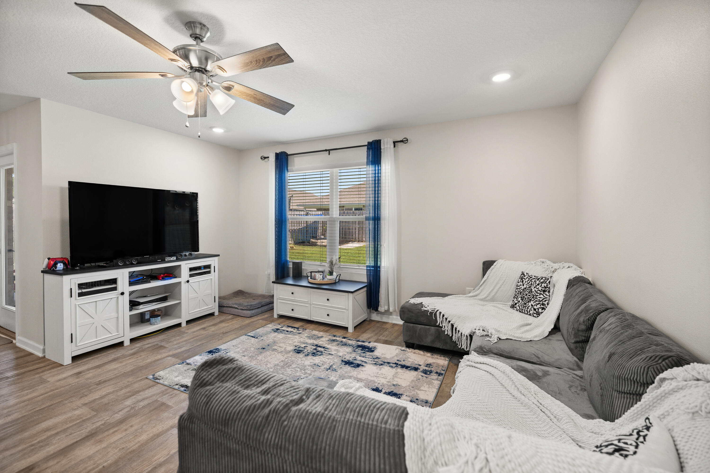 1016 Limpkin Street Crestview, FL 32539 - Photo 27 of 60 a living room with furniture and a flat screen tv