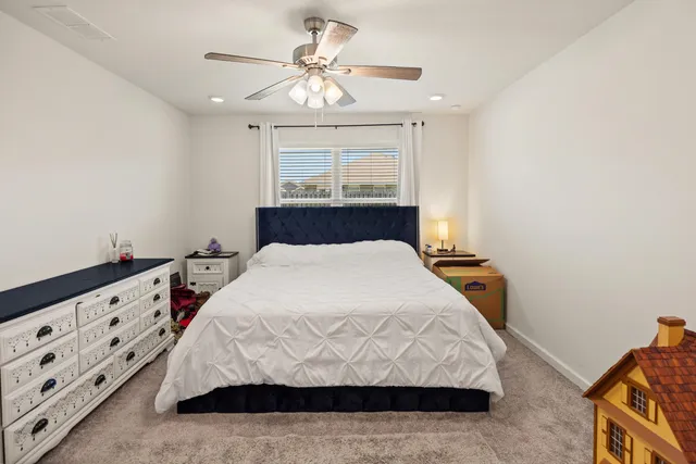 a view of walk in closet with clothes