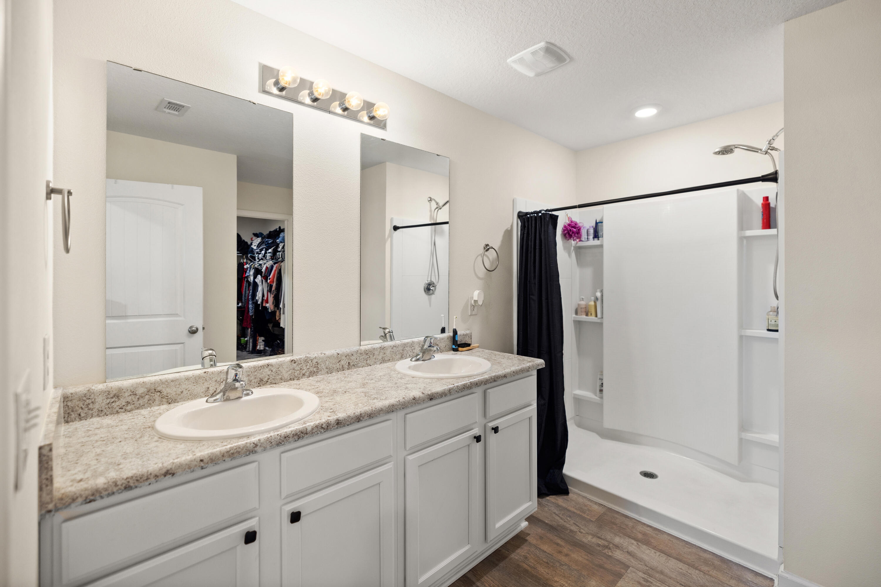 1016 Limpkin Street Crestview, FL 32539 - Photo 31 of 60 a bathroom with a shower sink vanity granite and shower