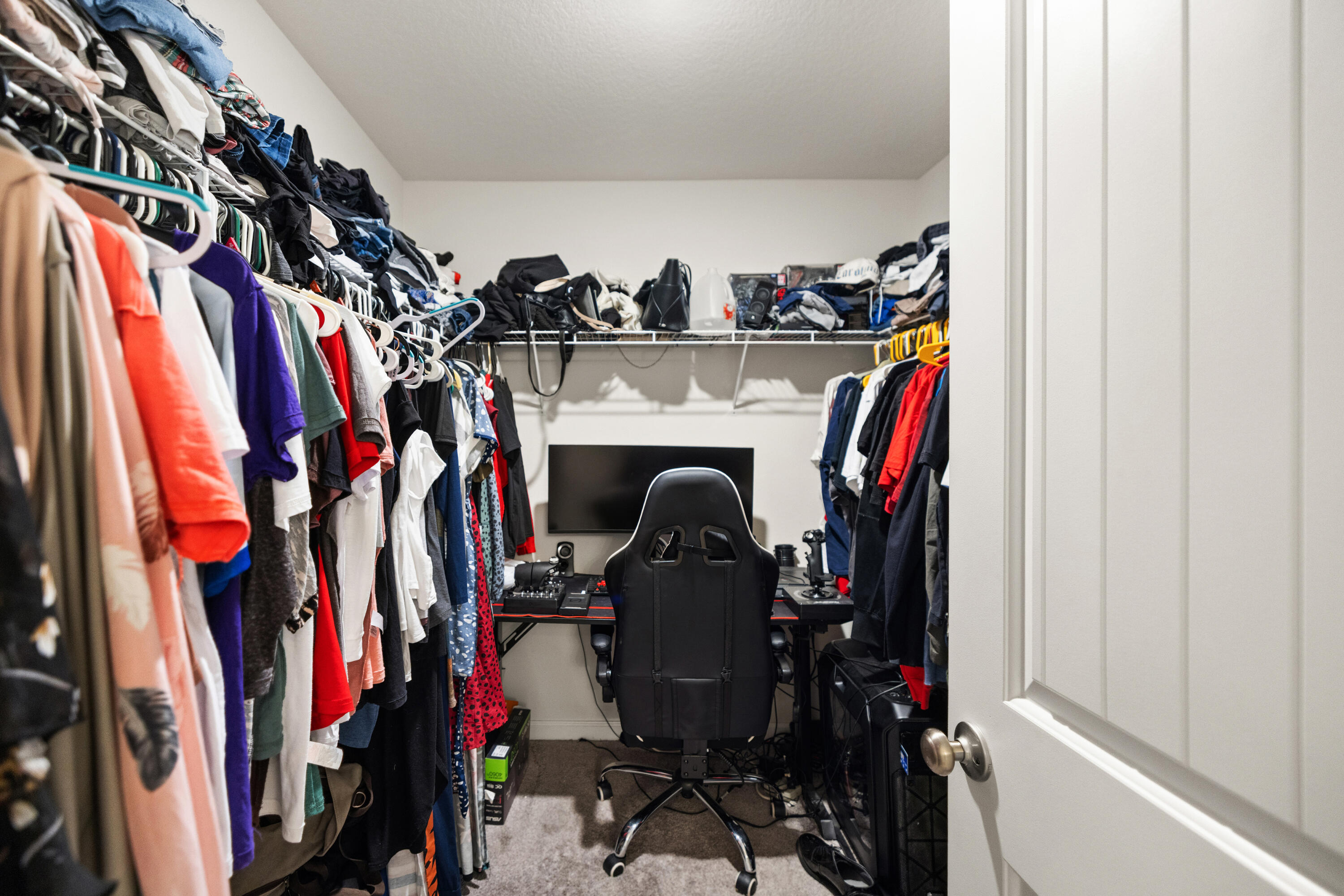 1016 Limpkin Street Crestview, FL 32539 - Photo 34 of 60 a view of walk in closet with clothes
