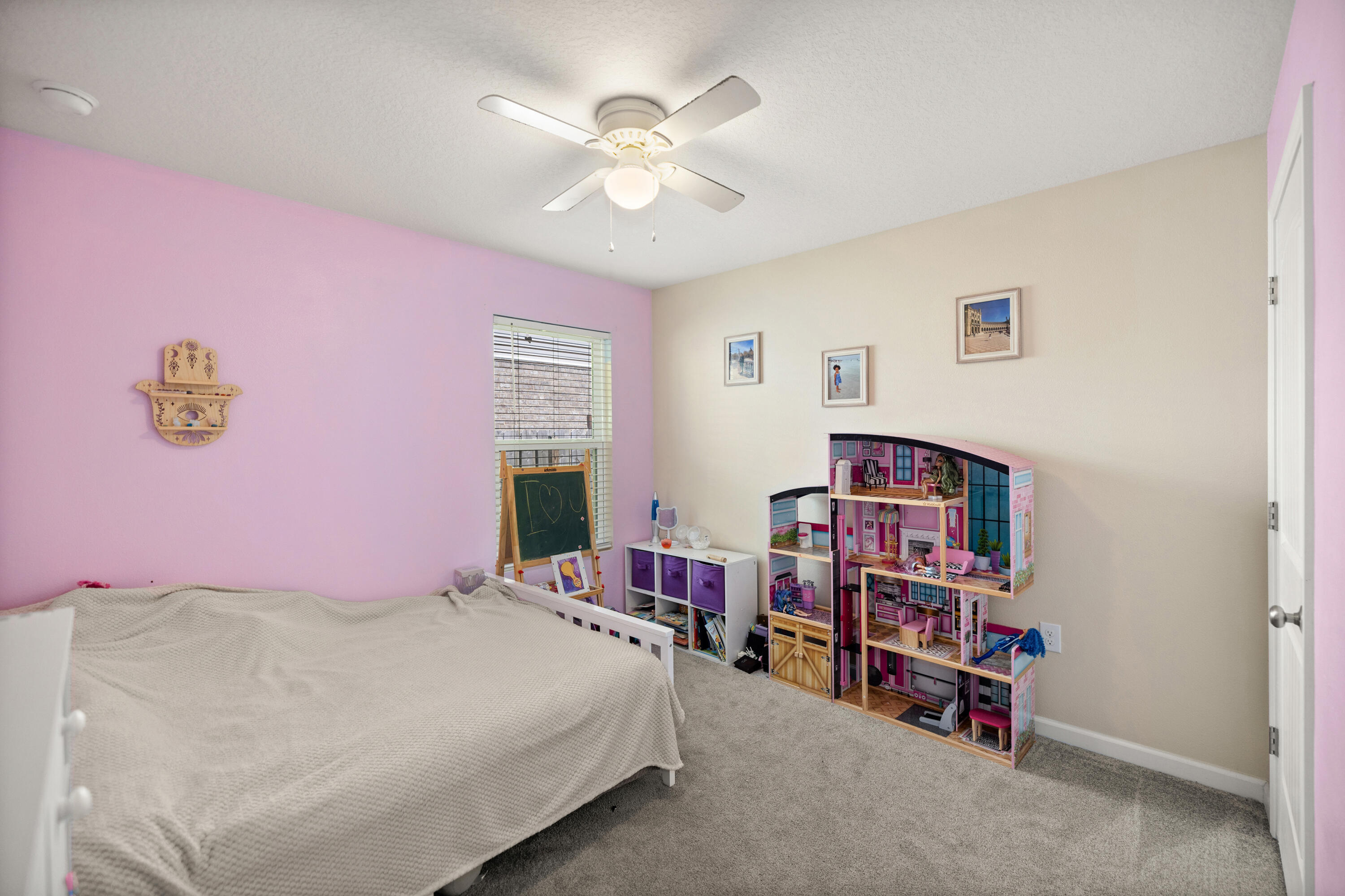 1016 Limpkin Street Crestview, FL 32539 - Photo 39 of 60 a bedroom with a bed and a book shelf