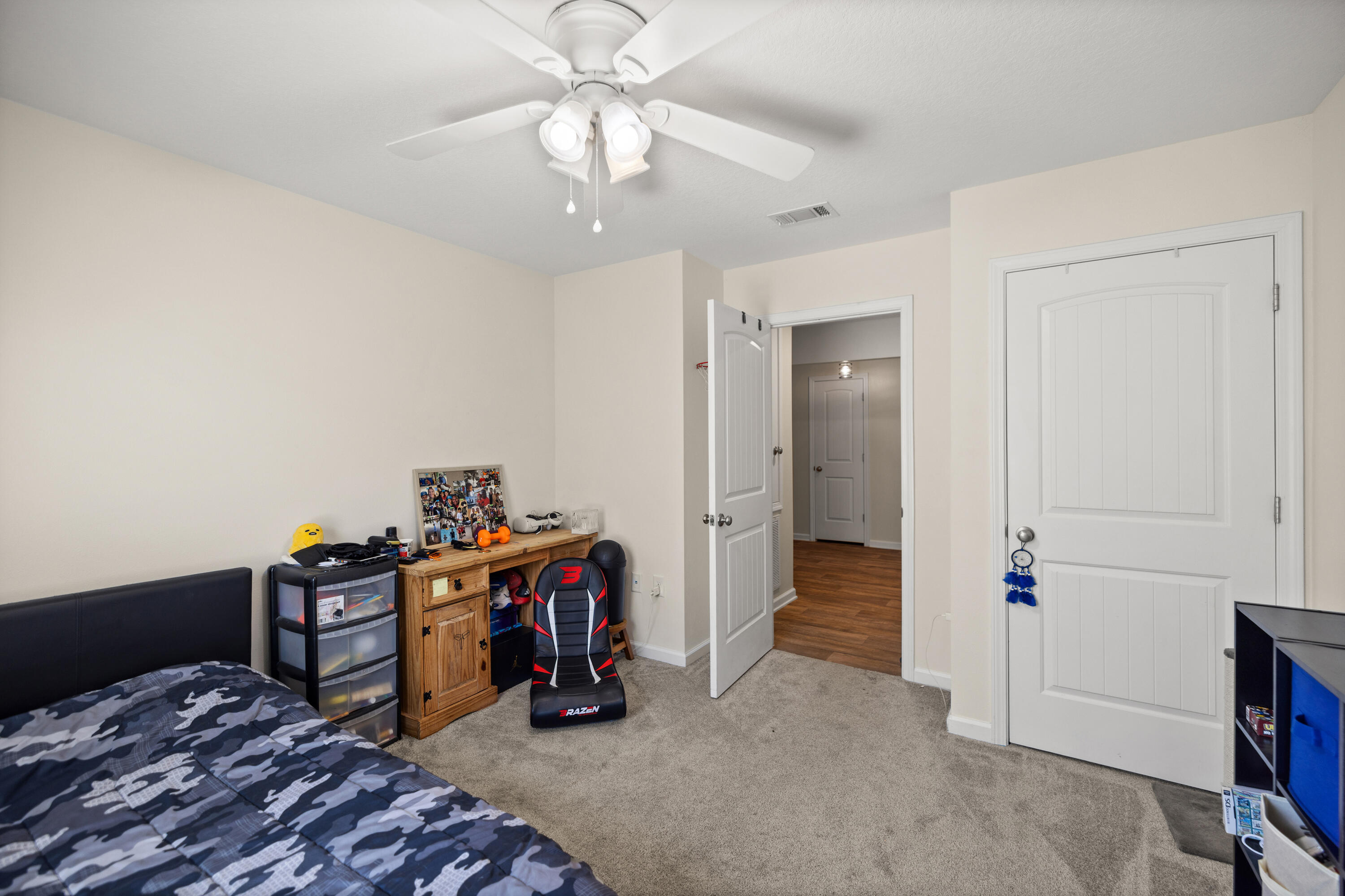1016 Limpkin Street Crestview, FL 32539 - Photo 43 of 60 a view of a bedroom with workspace and bedroom