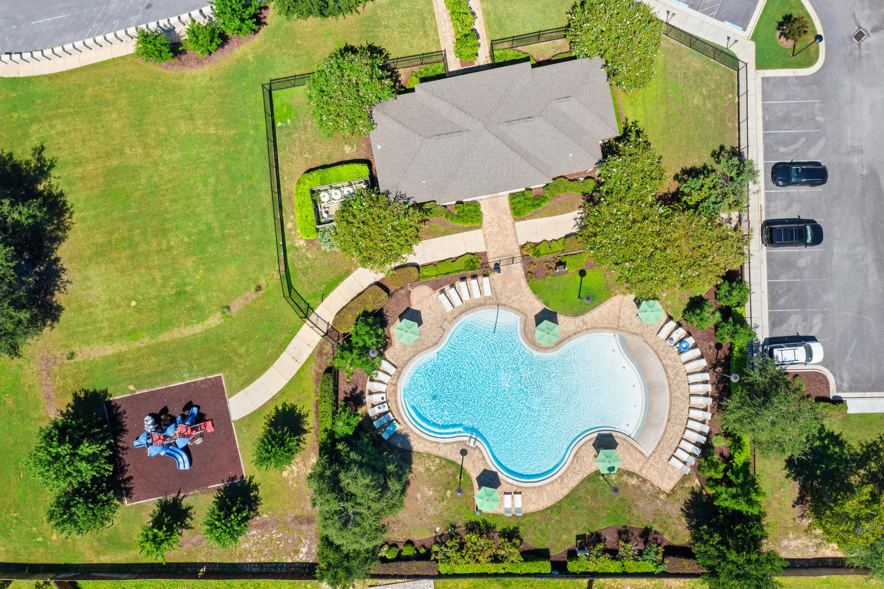 1016 Limpkin Street Crestview, FL 32539 - Photo 50 of 60 an aerial view of a swimming pool patio and outdoor seating