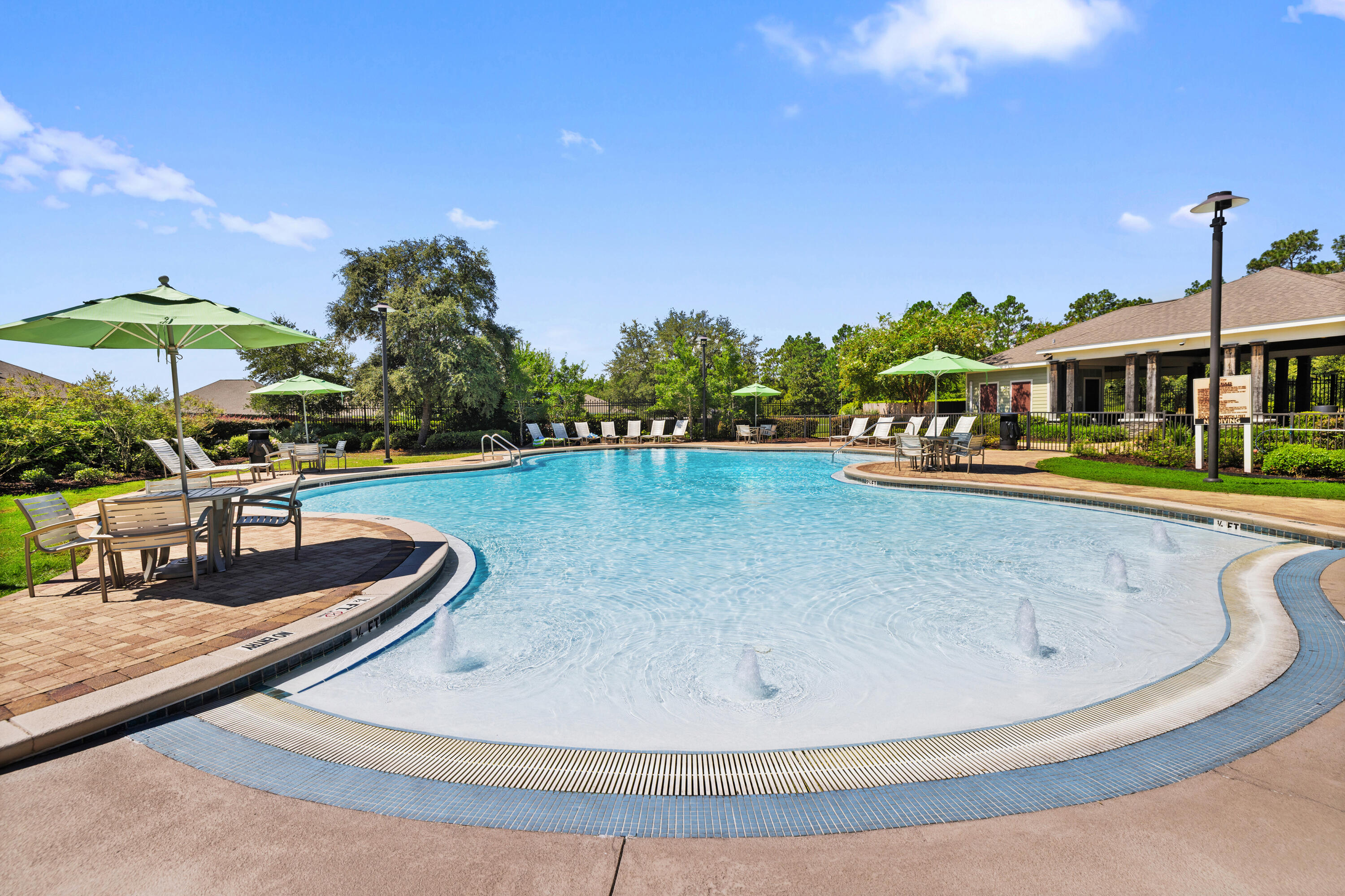 1016 Limpkin Street Crestview, FL 32539 - Photo 52 of 60 a view of a swimming pool with a patio
