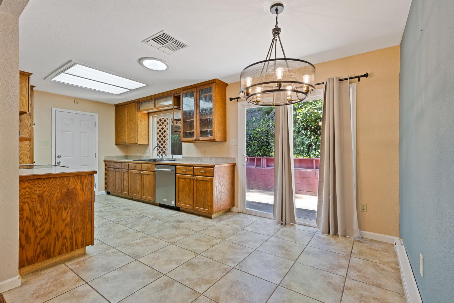 2971 Letitia Avenue Placerville, CA 95667 - Photo 57 of 65 a kitchen with stainless steel appliances granite countertop a stove a sink and a refrigerator