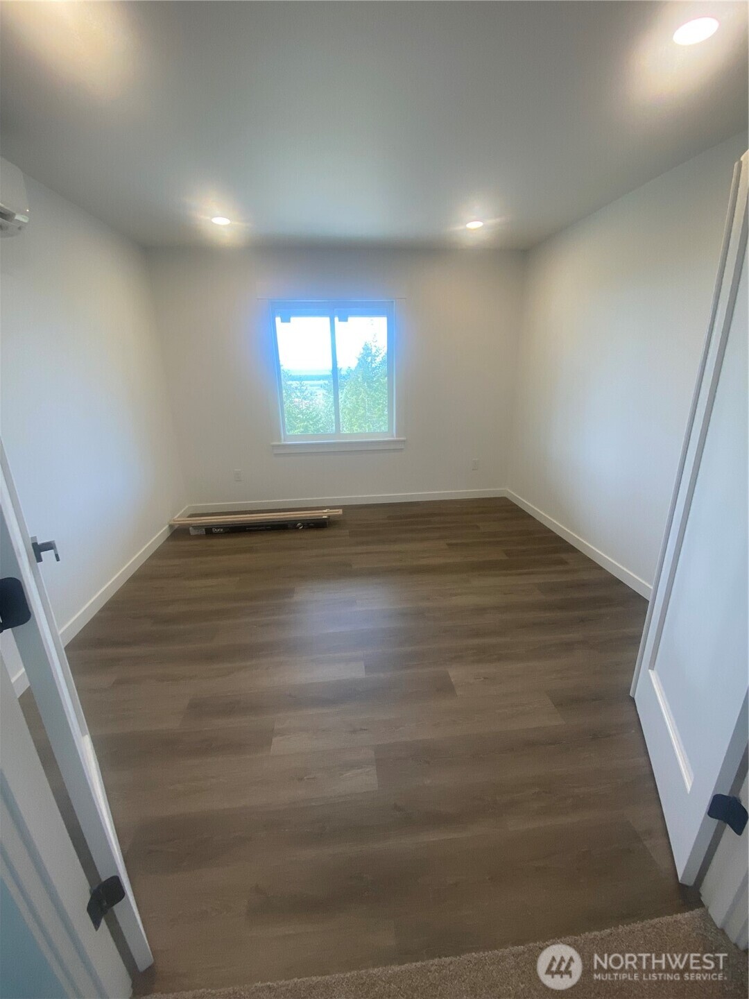 20555 Benson Ridge Mount Vernon, WA 98274 - Photo 22 of 40 an empty room with wooden floor and windows