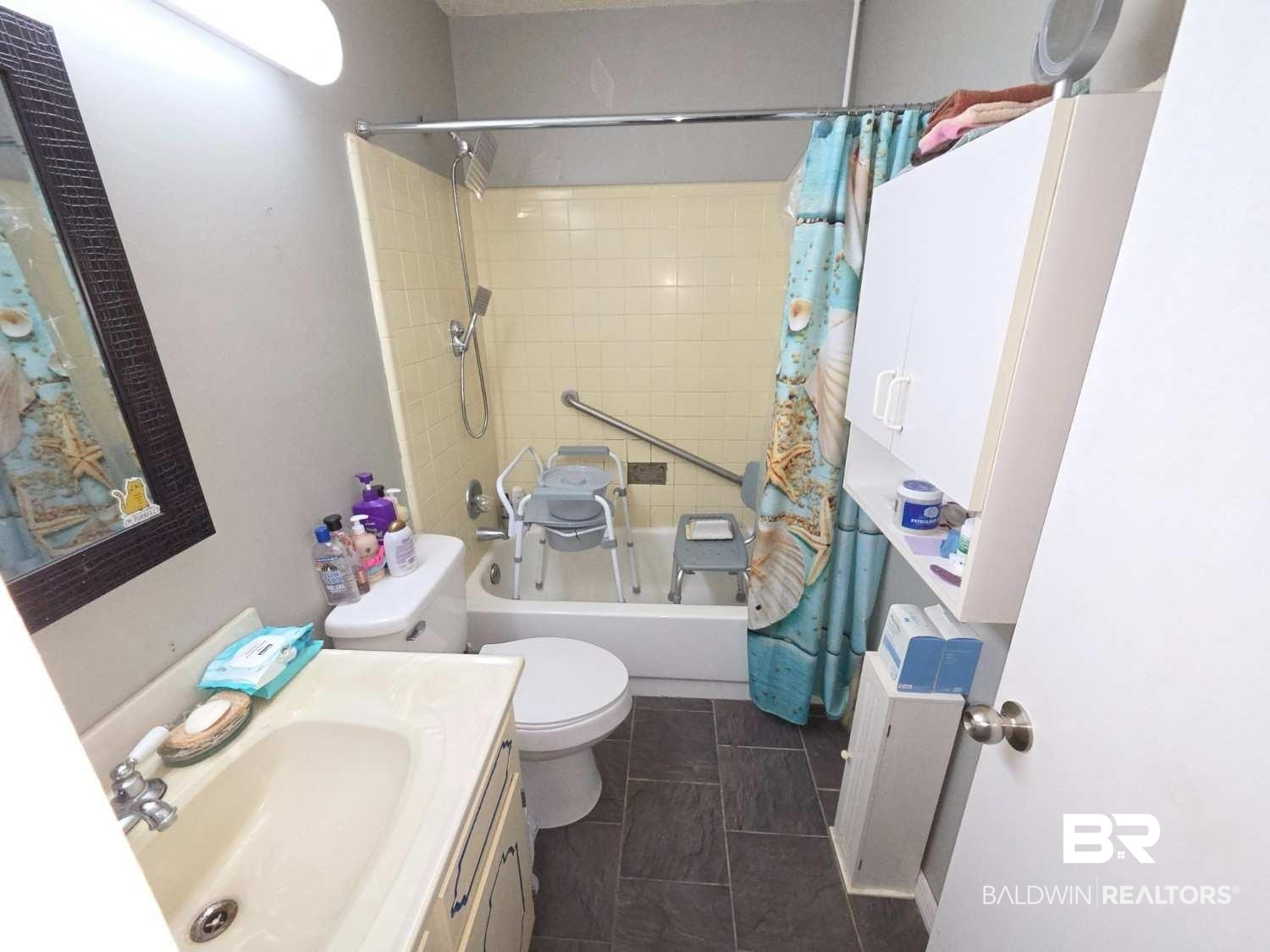 5120 West Celtic Drive Mobile, AL 36619 - Photo 19 of 27 Full bath featuring shower / bathtub combination with curtain, vanity, and radiator heating unit