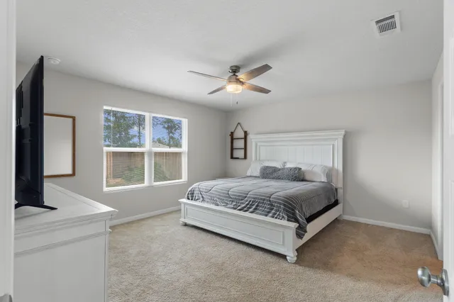 a living room with a fireplace and a flat screen tv