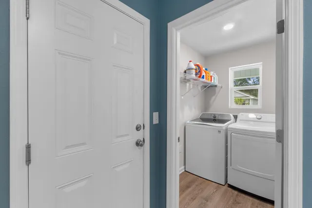 a bedroom with furniture and a flat screen tv