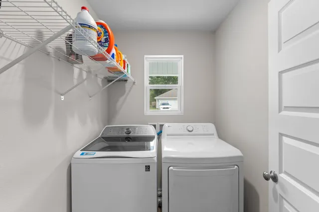 a utility room with dryer and washer