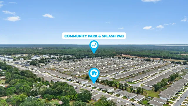 an aerial view of a house with a garden