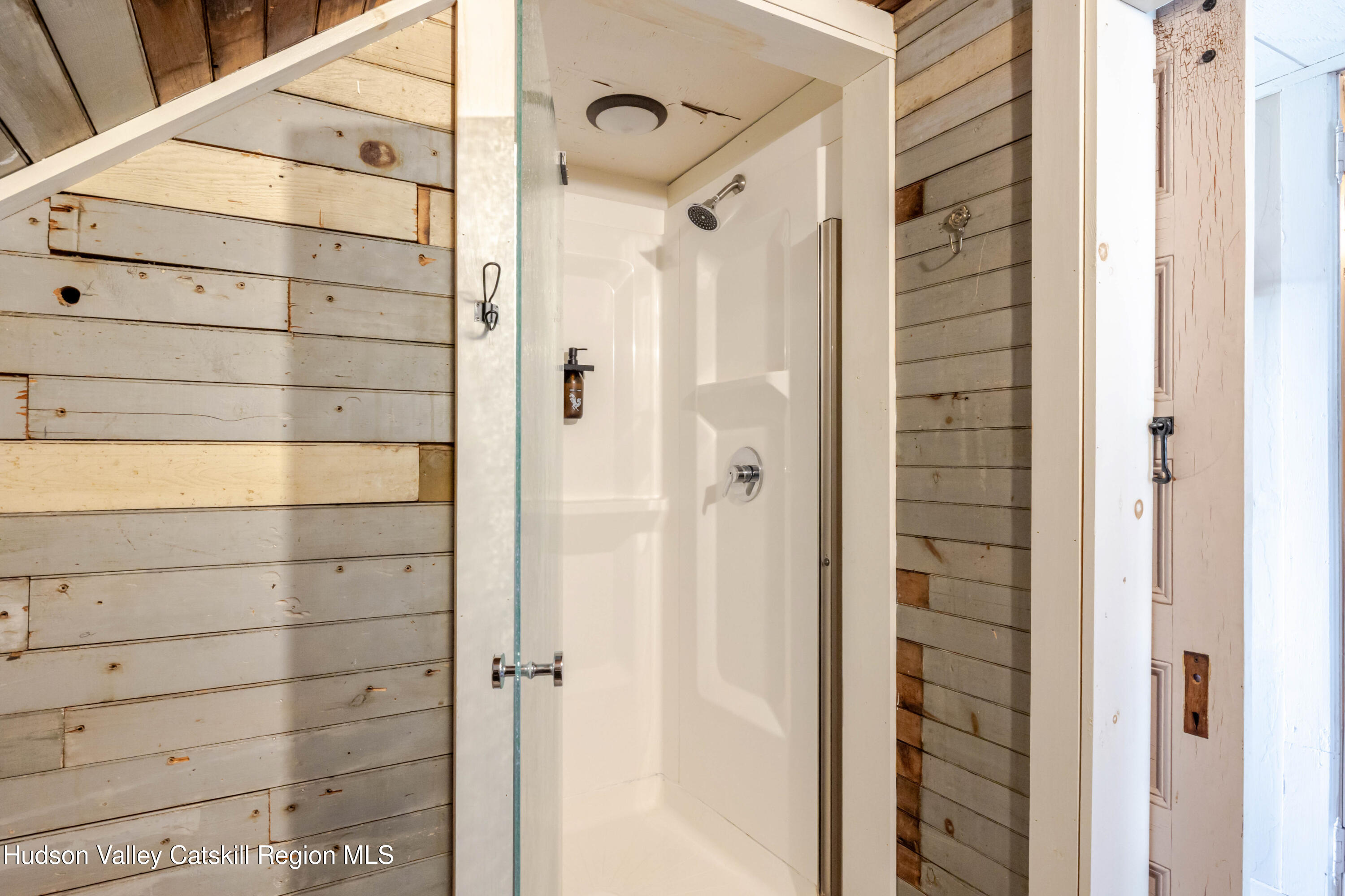 108 HIGH POND Road Summit, NY 12175 - Photo 53 of 82 a bathroom with a shower and a glass door