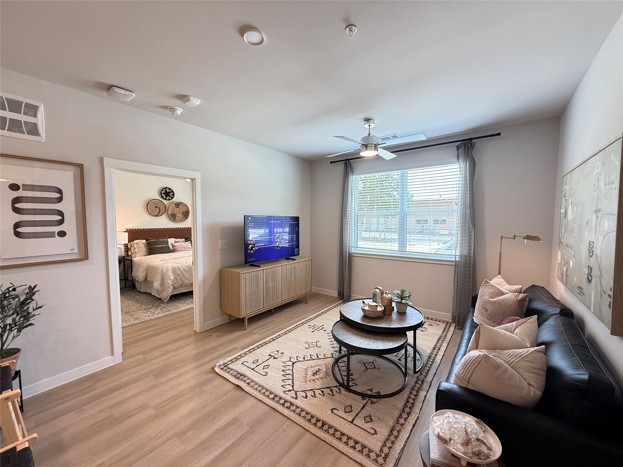 1610 Campbell Road, Unit B4 307 Houston, TX 77055 - Photo 3 of 12 a living room with furniture a rug and a window
