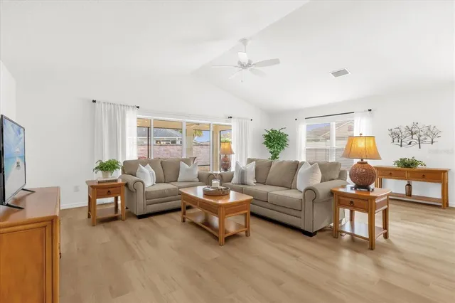 a kitchen with a sink a stove a refrigerator cabinets and a center island