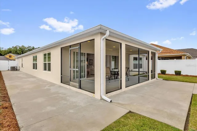 an aerial view of residential houses with outdoor space and street view