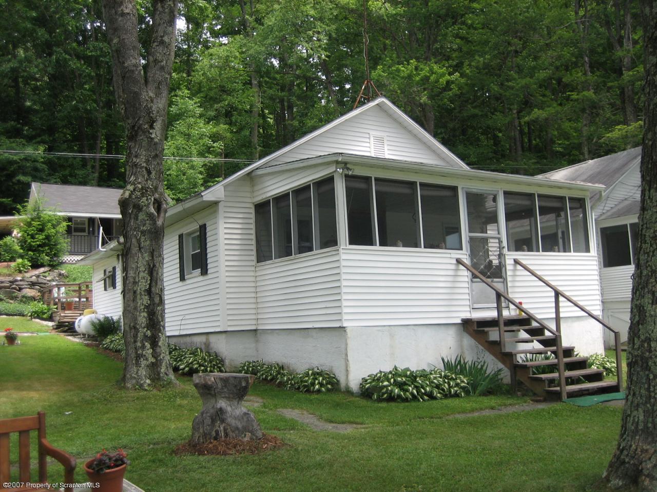 0 Reynolds Road Mansfield, PA 16933 - Photo 1 of 6 a front view of a house with a yard
