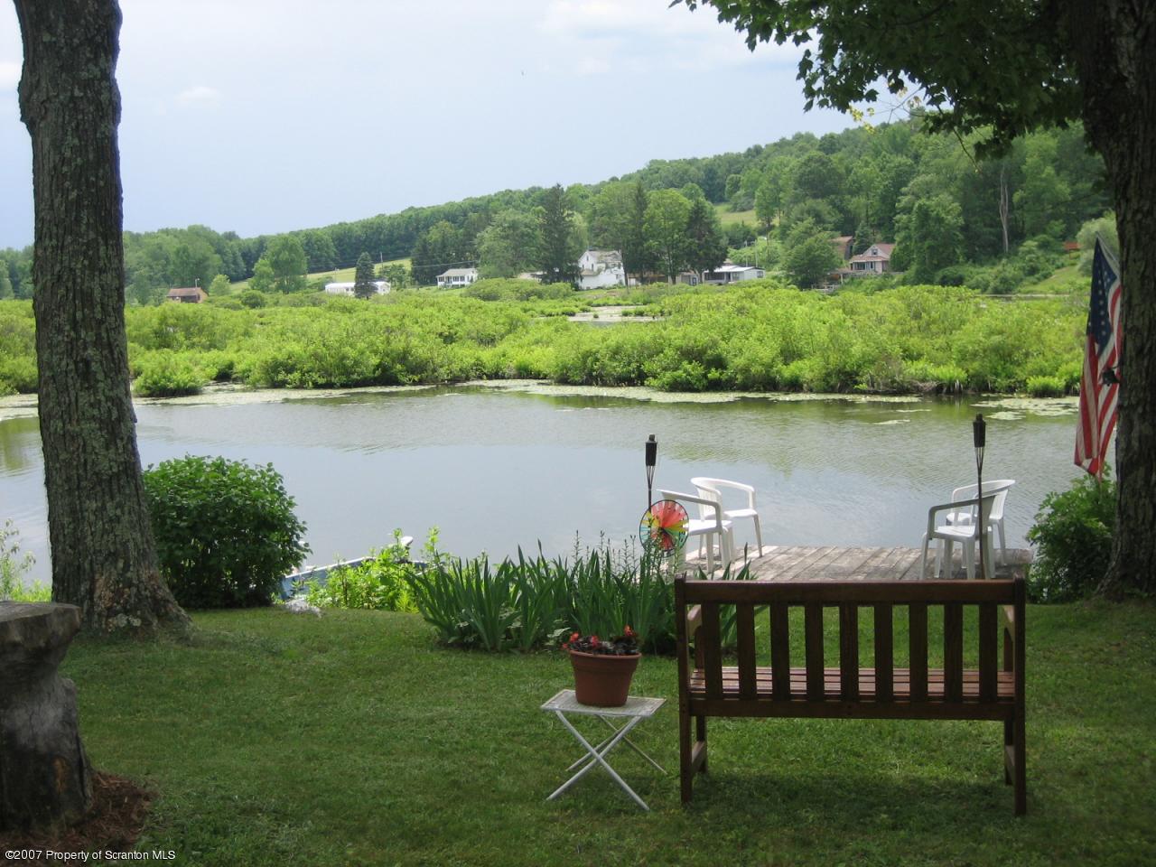 0 Reynolds Road Mansfield, PA 16933 - Photo 2 of 6 a view of a wooden deck with a lake view