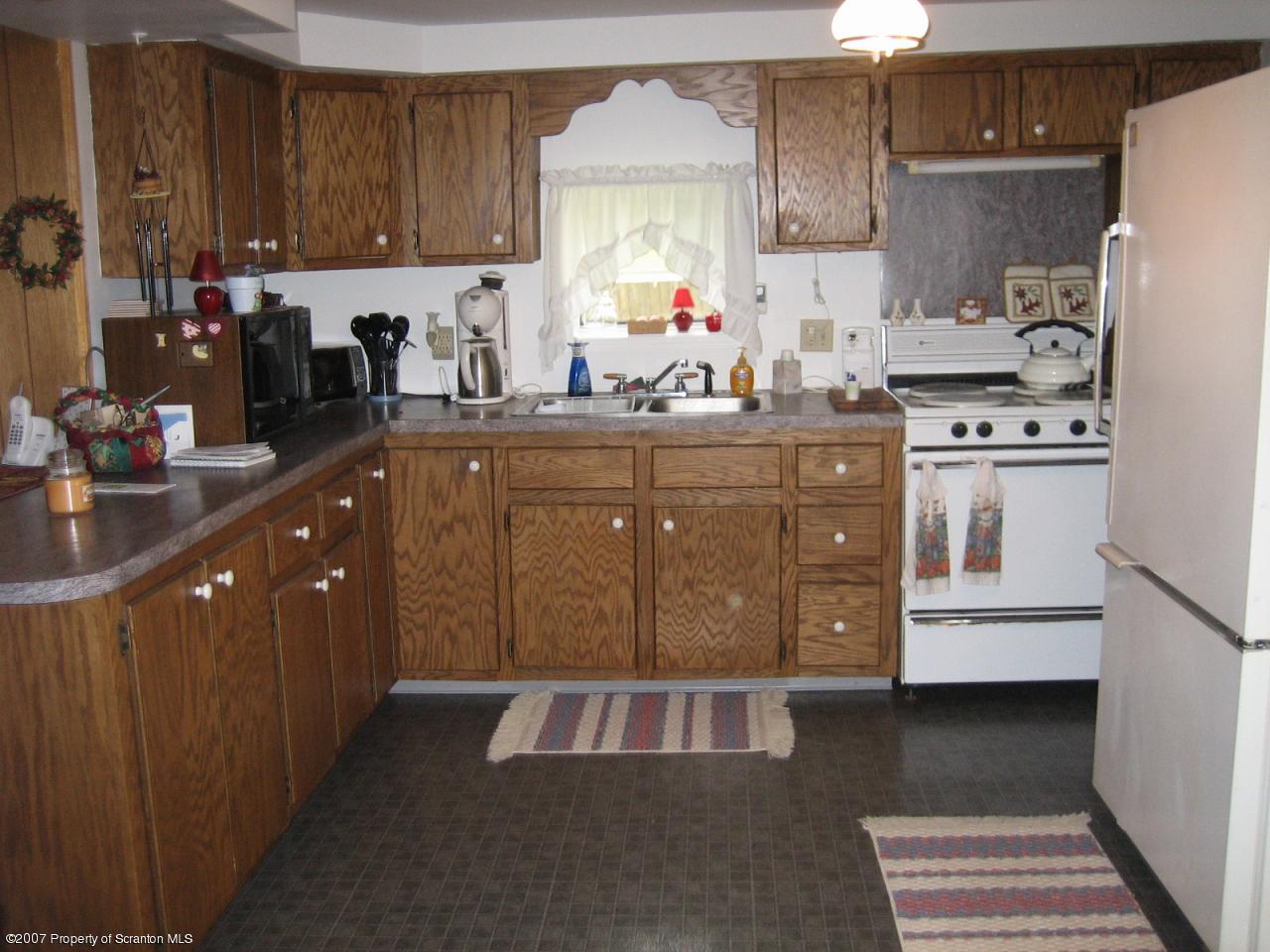 0 Reynolds Road Mansfield, PA 16933 - Photo 4 of 6 a kitchen with kitchen island granite countertop a sink stove and refrigerator