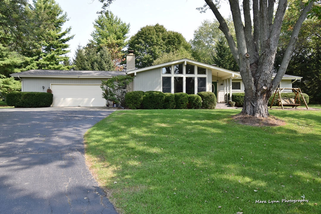 7N201 Stevens Road St. Charles, IL 60175 - Photo 1 of 58 a front view of a house with yard and green space