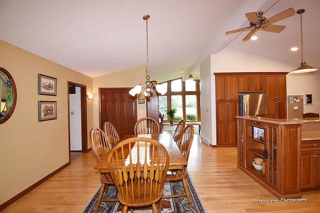 7N201 Stevens Road St. Charles, IL 60175 - Photo 16 of 58 a dining room with furniture a chandelier and wooden floor