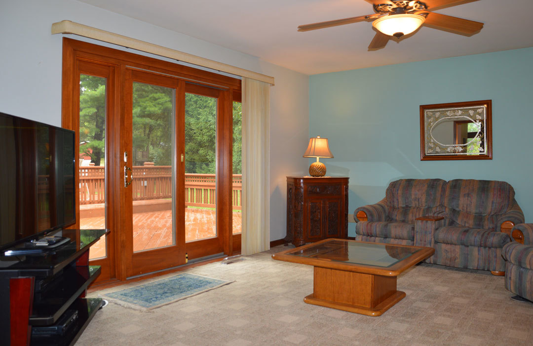 7N201 Stevens Road St. Charles, IL 60175 - Photo 19 of 58 a living room with furniture a flat screen tv and a fireplace