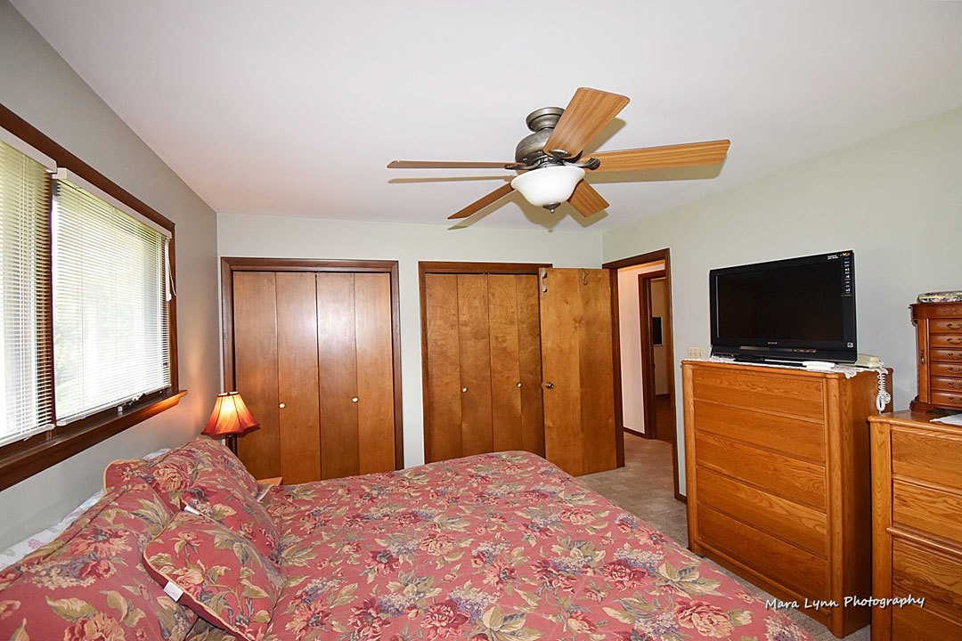 7N201 Stevens Road St. Charles, IL 60175 - Photo 25 of 58 a bedroom with a bed and a flat screen tv