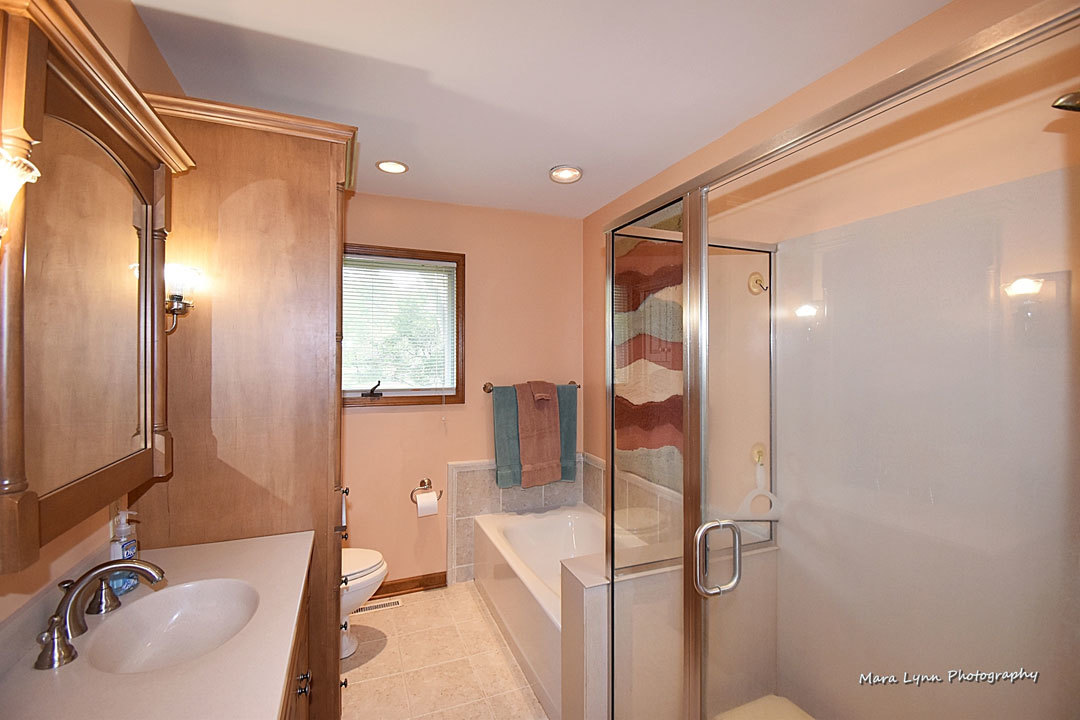 7N201 Stevens Road St. Charles, IL 60175 - Photo 26 of 58 a bathroom with a tub sink and mirror