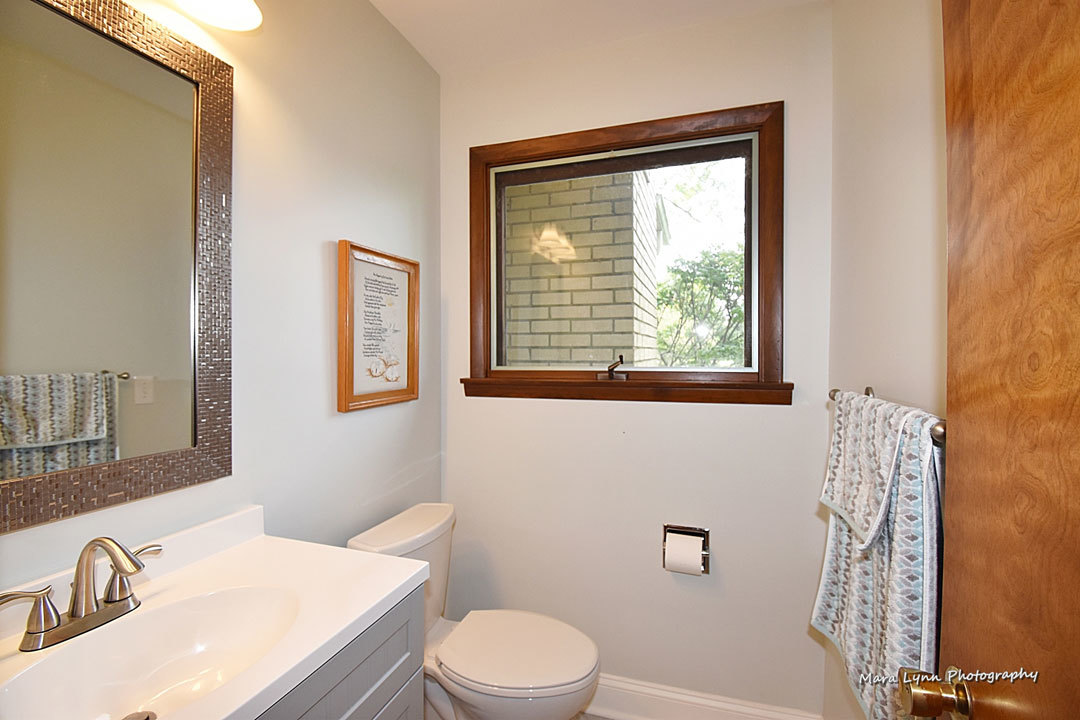 7N201 Stevens Road St. Charles, IL 60175 - Photo 33 of 58 a bathroom with a sink a toilet and a window