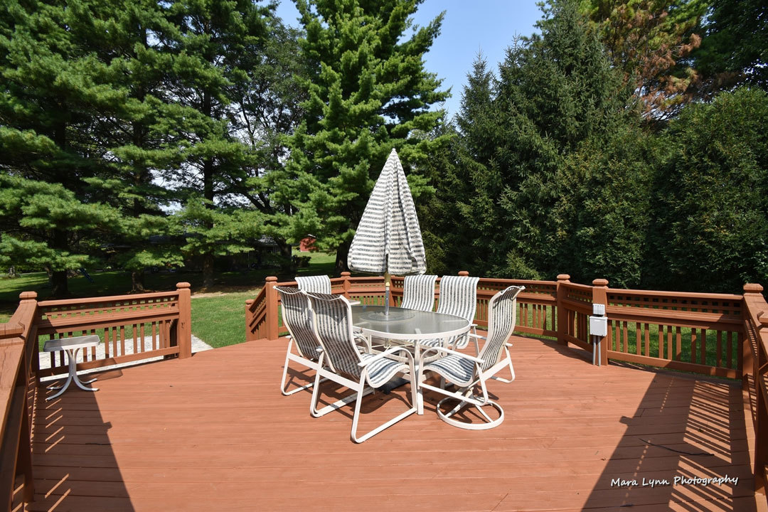 7N201 Stevens Road St. Charles, IL 60175 - Photo 58 of 58 a view of a roof deck with table and chairs a barbeque with wooden floor and fence