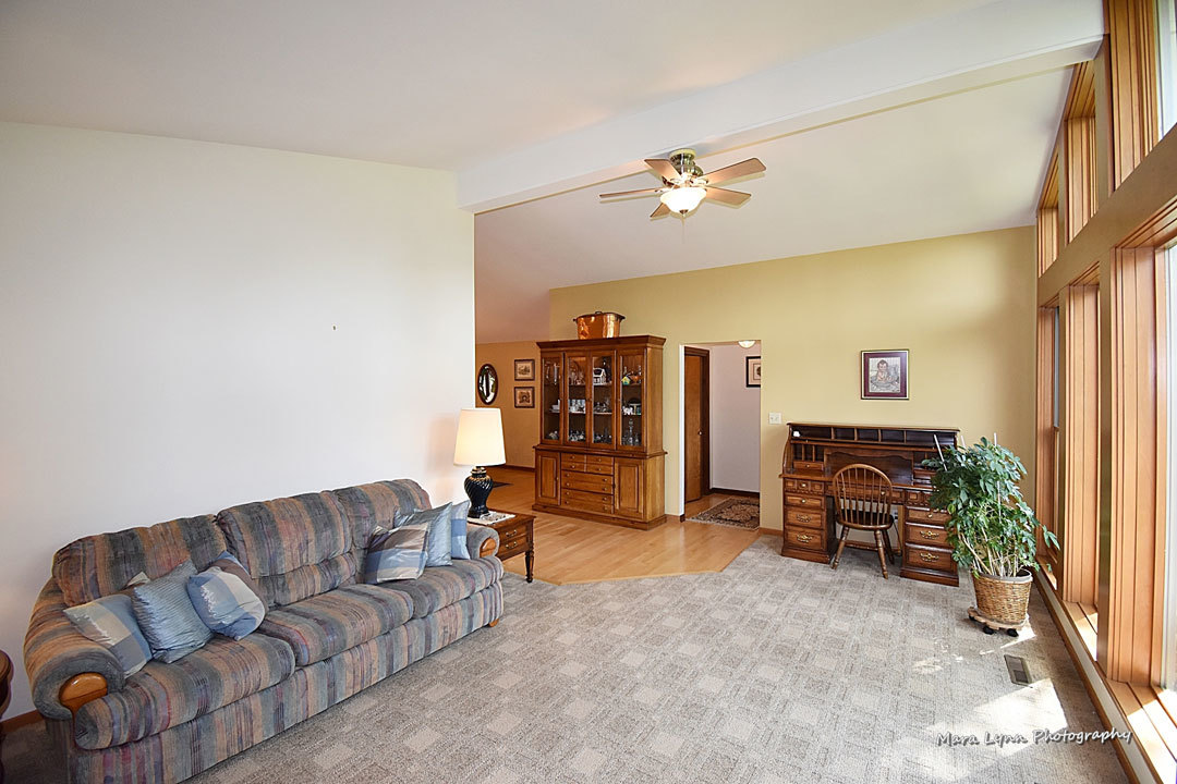 7N201 Stevens Road St. Charles, IL 60175 - Photo 8 of 58 a living room with furniture and a flat screen tv