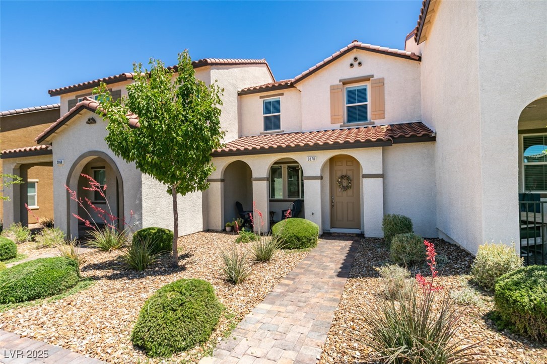 2870 Turnstone Ridge Street Henderson, NV 89044 - Photo 1 of 50 Mediterranean / spanish-style home featuring a tiled roof and stucco siding
