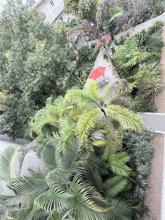 a backyard of a house with a yard and outdoor seating