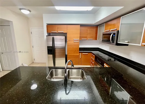 a kitchen with a sink and a window