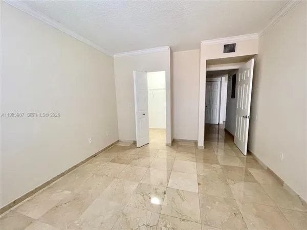 a view of a hallway with closet and entryway