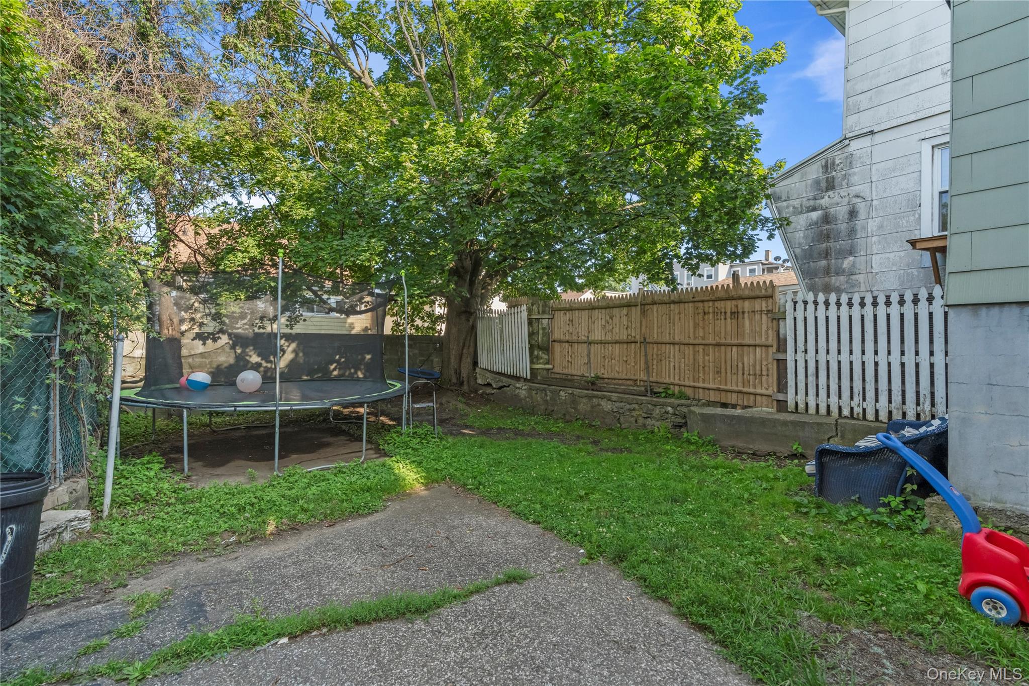 43 Washington Street Port Chester, NY 10573 - Photo 28 of 30 Fenced backyard with a trampoline