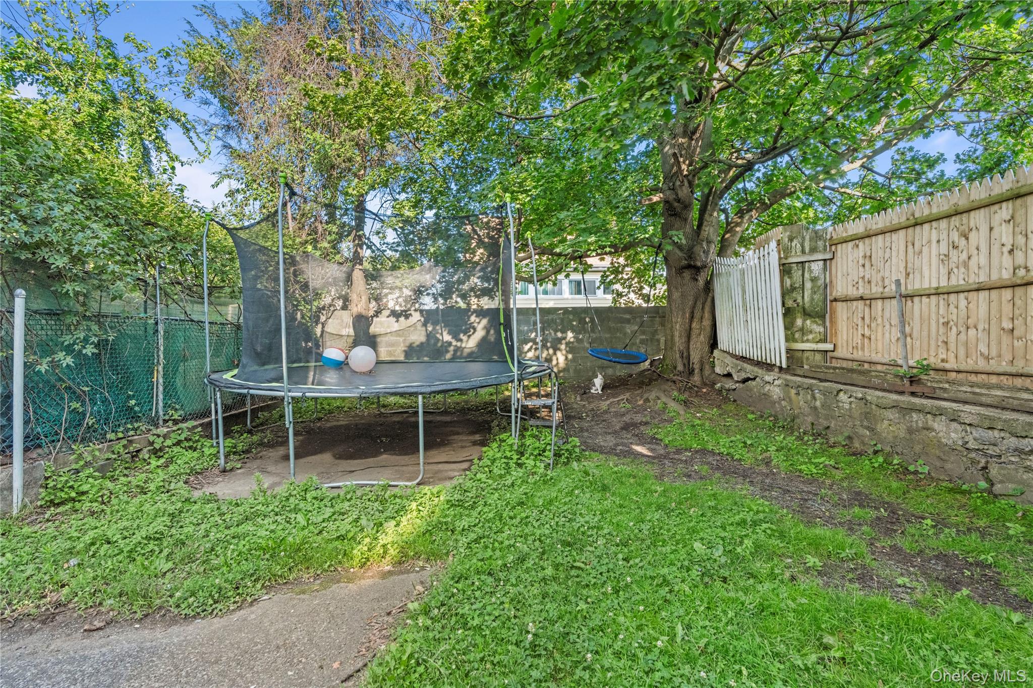 43 Washington Street Port Chester, NY 10573 - Photo 29 of 30 Fenced backyard with a trampoline