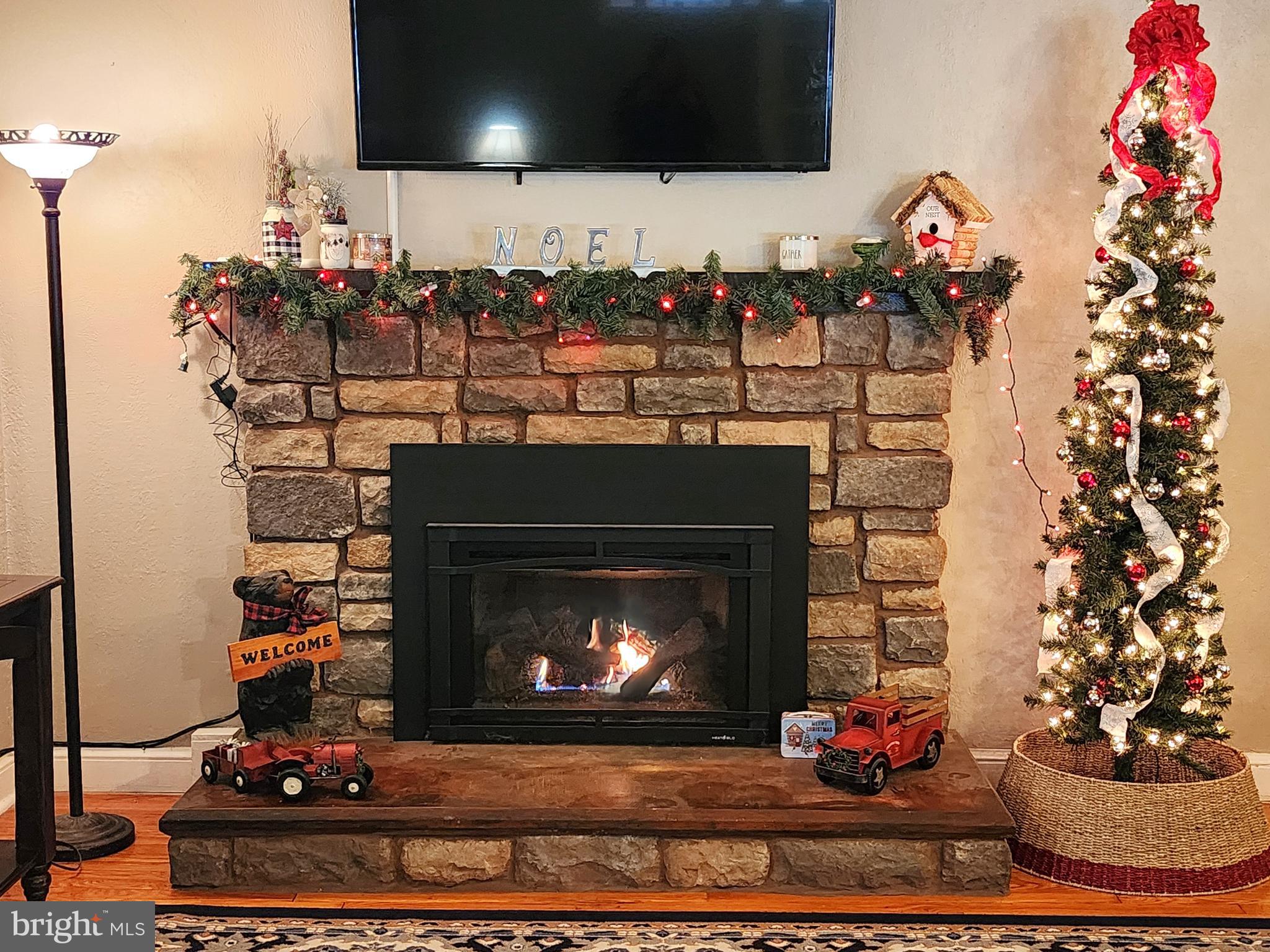 has beautiful stone fireplace with gas logs,