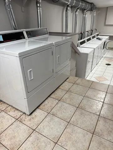a utility room with washer and dryer