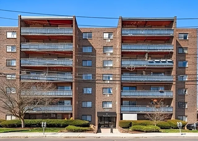 a front view of a building with a street