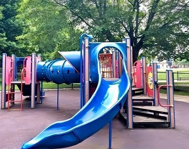 a roof deck with table and chairs a barbeque