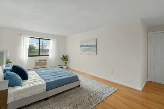 a living room with couch and a window