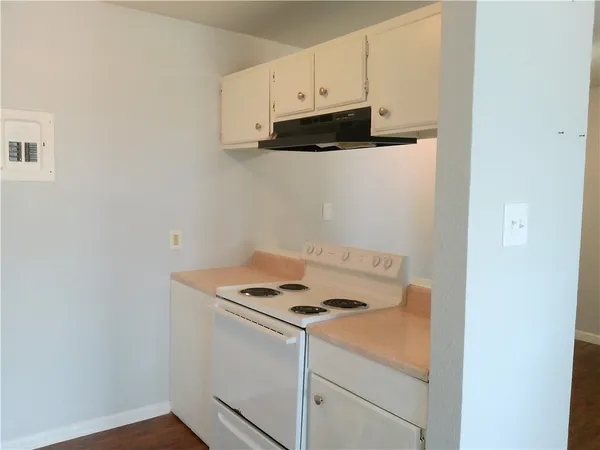 a kitchen with a stove and a microwave