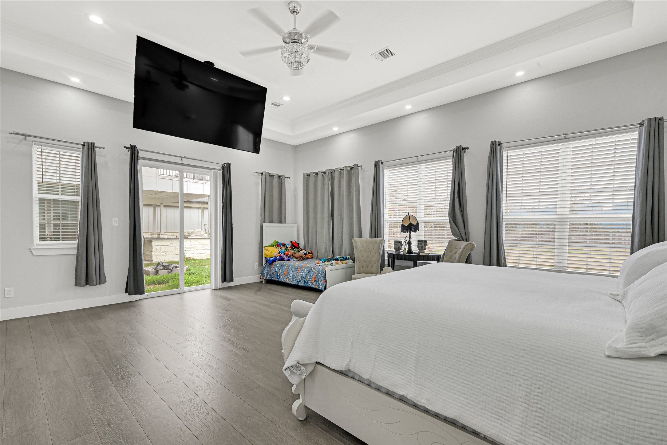 4821 1st Street Houston, TX 77504 - Photo 20 of 48 a spacious bedroom with a large bed and a flat tv screen on dresser