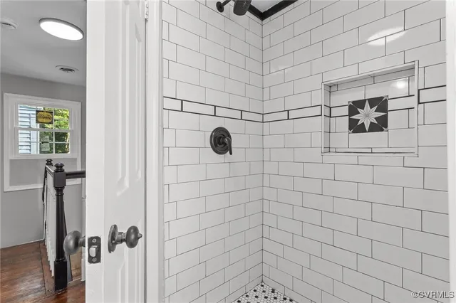 a view of an entryway with wooden floor