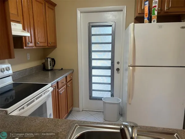 a view of a kitchen with washer and dryer