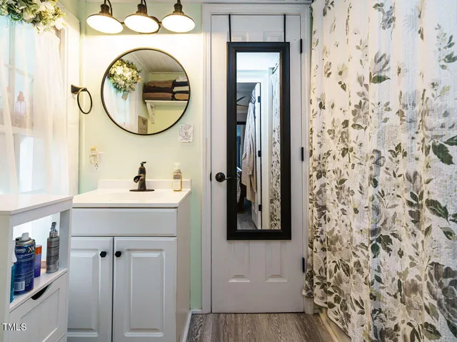 a bathroom with a sink and a mirror