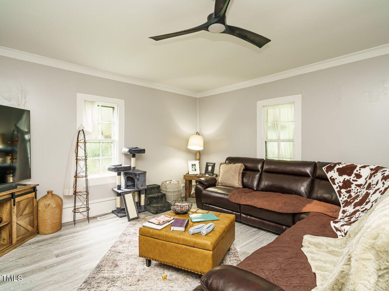 7105 Great Swamp Loop Lucama, NC 27851 - Photo 6 of 28 a living room with furniture and a flat screen tv