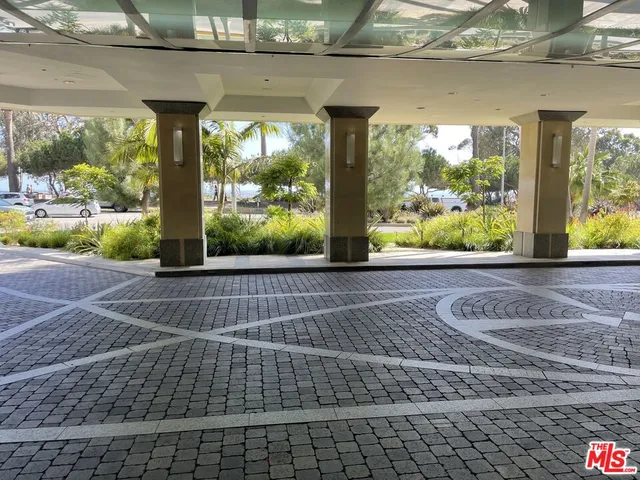 a view of a room with a floor to ceiling window