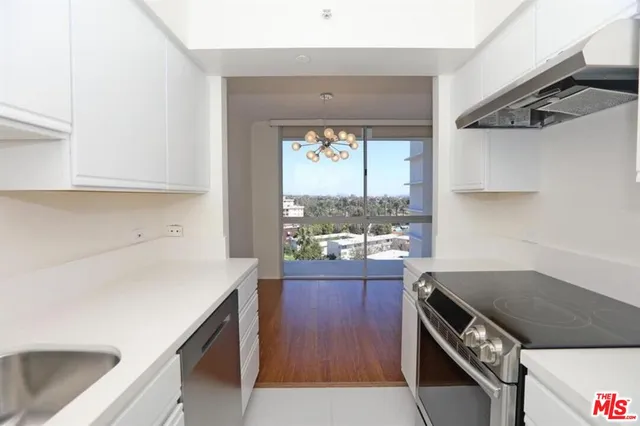 a kitchen that has a stove and a microwave