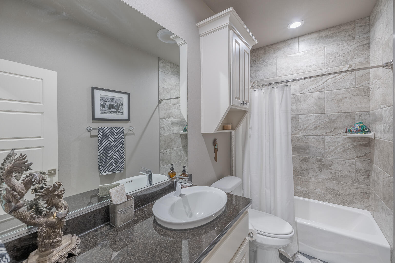 2109 101st Street Lubbock, TX 79423 - Photo 11 of 49 a bathroom with a sink toilet and shower